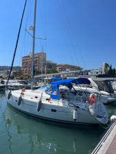 Beneteau Oceanis Clipper 361 2001 Beneteau Oceanis Clipper 361 sailboat docked in marina under clear blue sky.