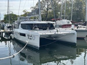 Leopard 45 2021 Leopard 45 catamaran docked in a marina, named "About Time."