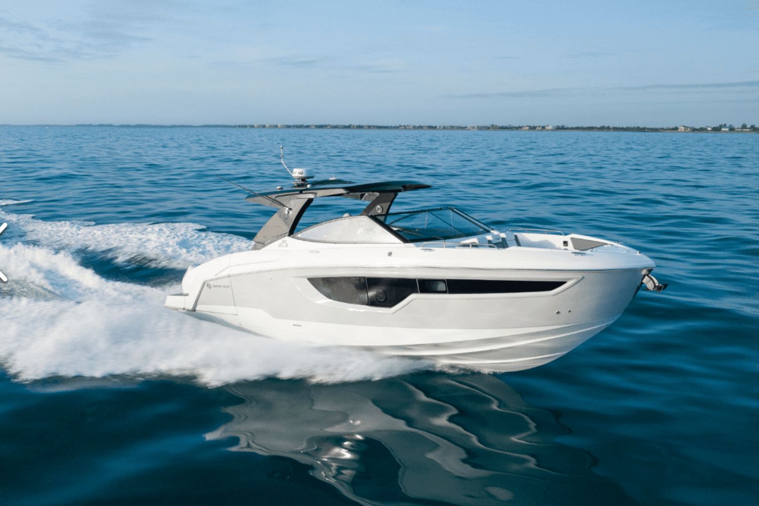 Cruisers Yachts 38 GLS OB 2026 Cruisers Yachts 38 GLS OB speeding on open water.
