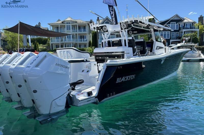 Blackfin 400 CC 2025 Blackfin 400 CC boat with Mercury engines docked at marina.