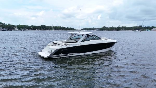 Cobalt A40 2015 Cobalt A40 boat on calm water under cloudy sky.