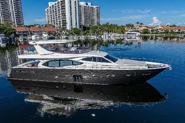 Ferretti Yachts 780 2009 Ferretti Yachts 780 on calm water, with cityscape background.