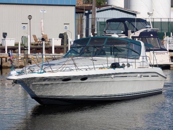 Sea Ray 400 Express Cruiser 1995 Sea Ray 400 Express Cruiser docked at a marina.