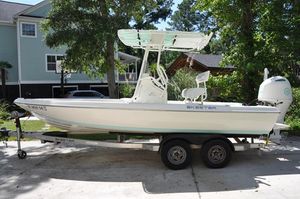Skeeter SX210 2017 Skeeter SX 210 boat on trailer, parked in residential driveway.