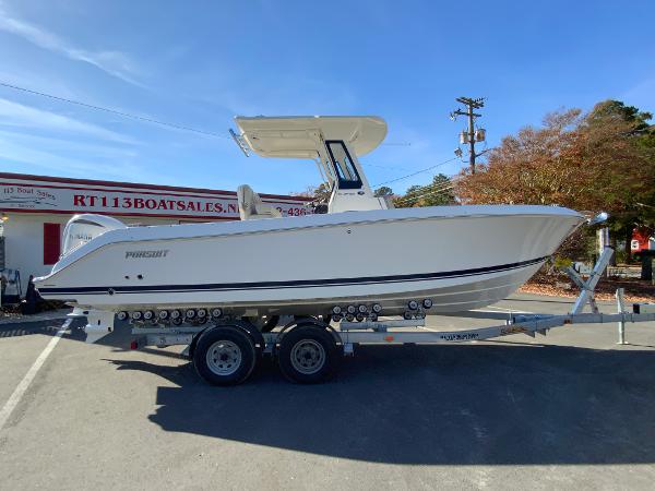 Pursuit S 248 Sport 2025 Pursuit S 248 Sport boat on trailer at dealership.