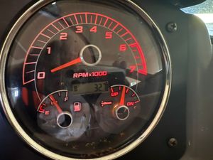 Hurricane SunDeck 2486 OB Close-up of a 2021 Hurricane SunDeck 2486 OB tachometer showing RPM and fuel gauge.