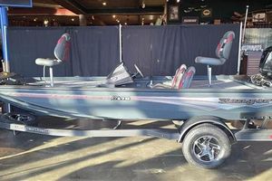 Ranger RT178 2025 Ranger RT178 fishing boat on trailer, displayed indoors.