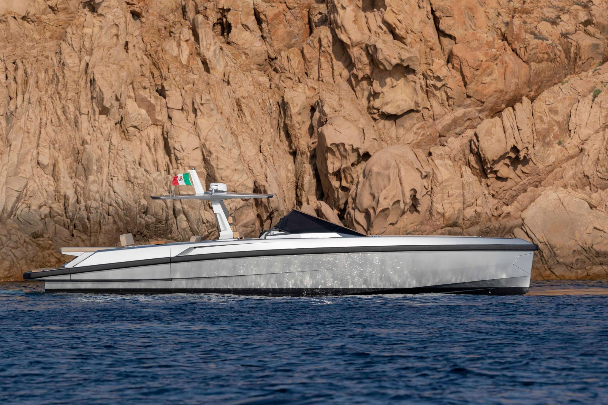 Wally WallyTender48 2023 Wally WallyTender48 yacht cruising near rocky coastline.