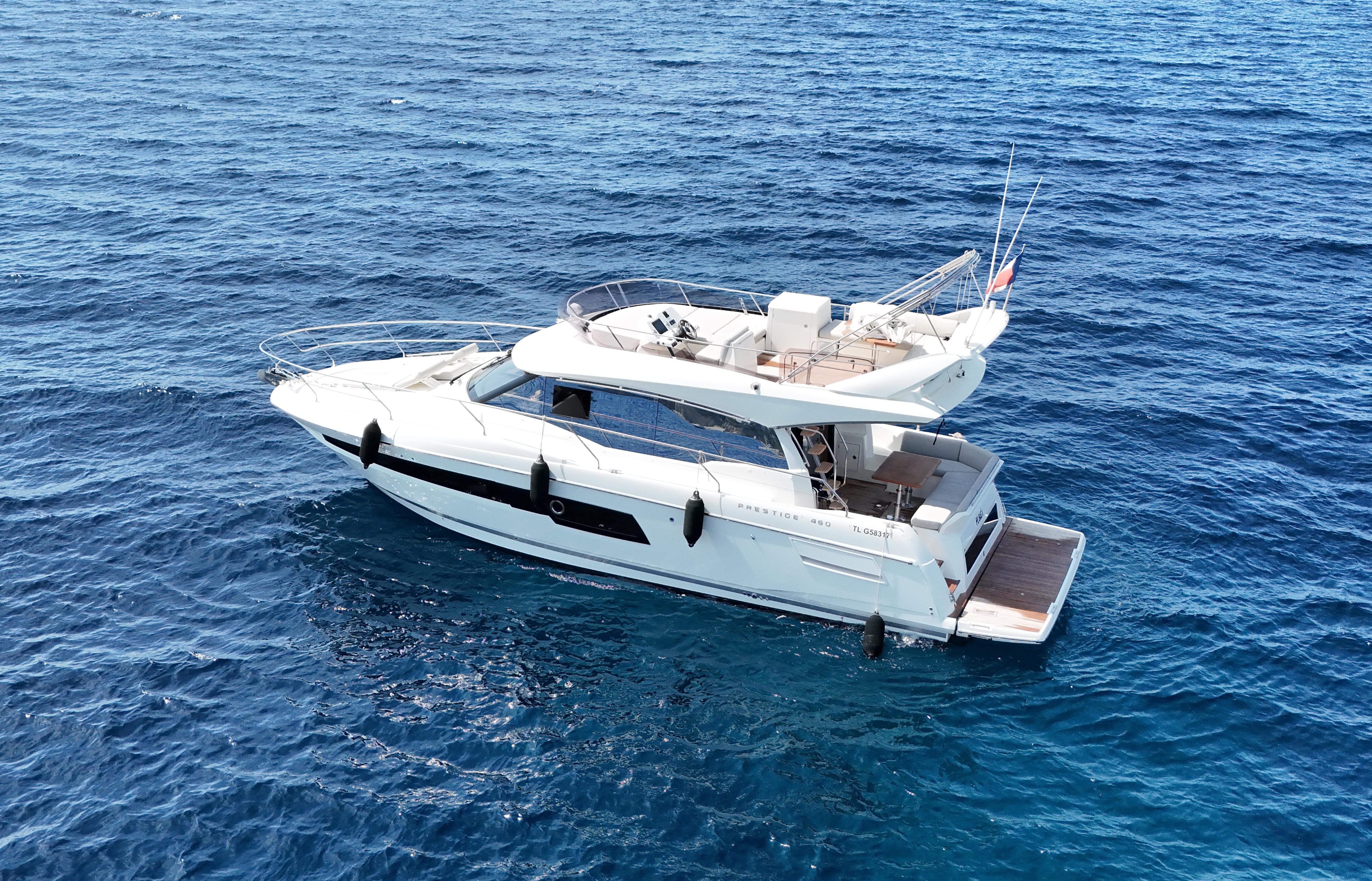 Prestige 460 Fly 2018 Prestige 460 Fly yacht cruising on open blue sea.