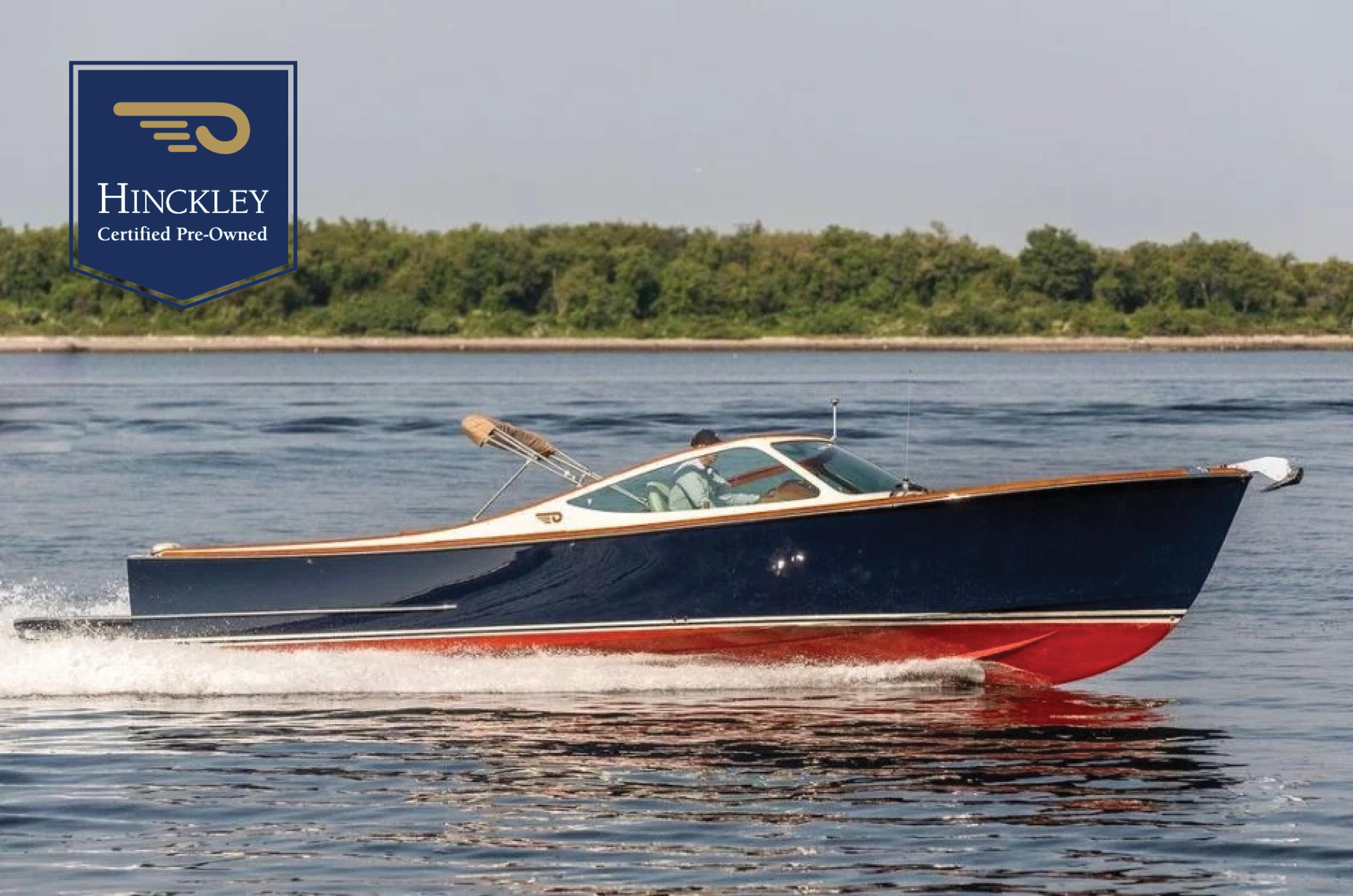 Hinckley Talaria 29R 2003 Hinckley Talaria 29R boat cruising on water, certified pre-owned.