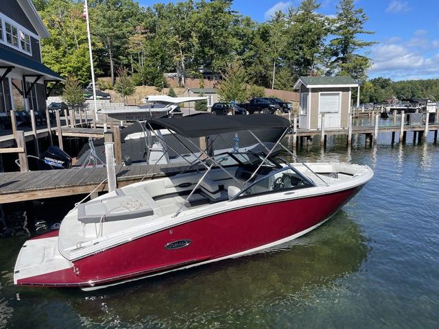 Cobalt CS22 2024 Cobalt CS22 boat docked on a sunny day, featuring a sleek red design.