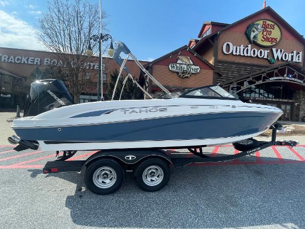 Tahoe 210 S 2024 Tahoe 210 S boat on trailer outside Bass Pro Shops Outdoor World.