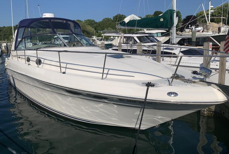 Sea Ray 340 Sundancer 2001 Sea Ray 340 Sundancer yacht docked in marina, clear sky background.