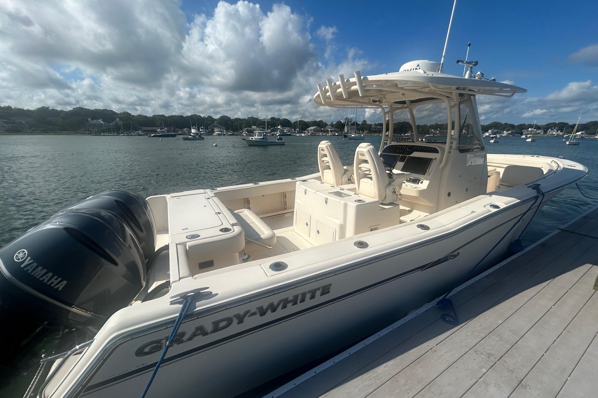 Grady-White Canyon 306 2017 Grady-White Canyon 306 boat docked, featuring Yamaha engines, under a clear sky.