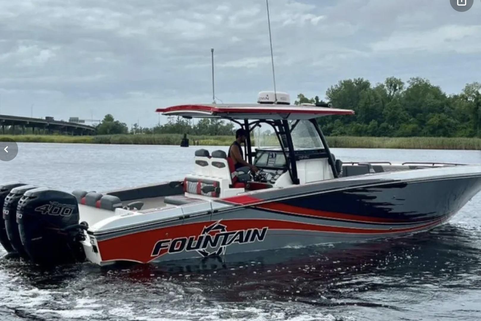 Fountain 38 SC 2022 Fountain 38 SC boat on water, featuring sleek design and powerful engines.