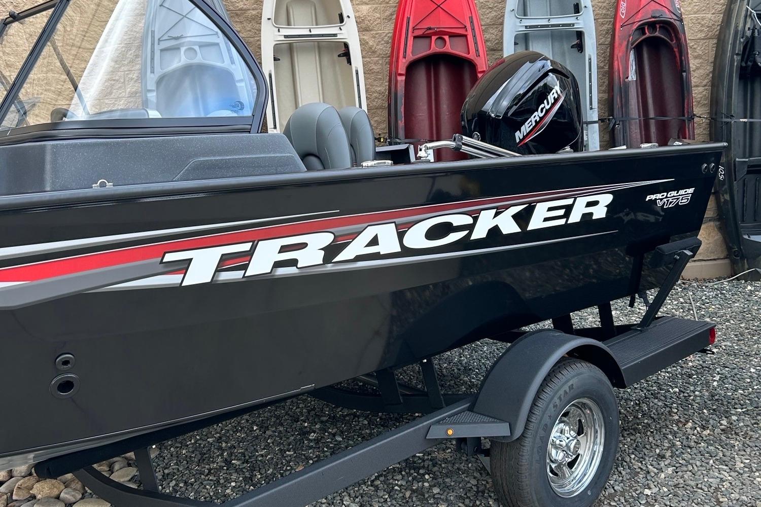Tracker Pro Guide V-175 WT 2026 Tracker Pro Guide V-175 WT boat with Mercury engine, displayed outdoors.