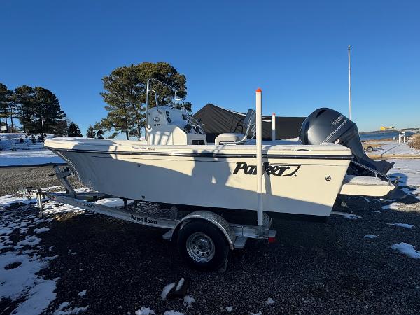 Parker 18 Special Edition 2025 Parker 18 SE boat on trailer, parked outdoors in snowy setting.