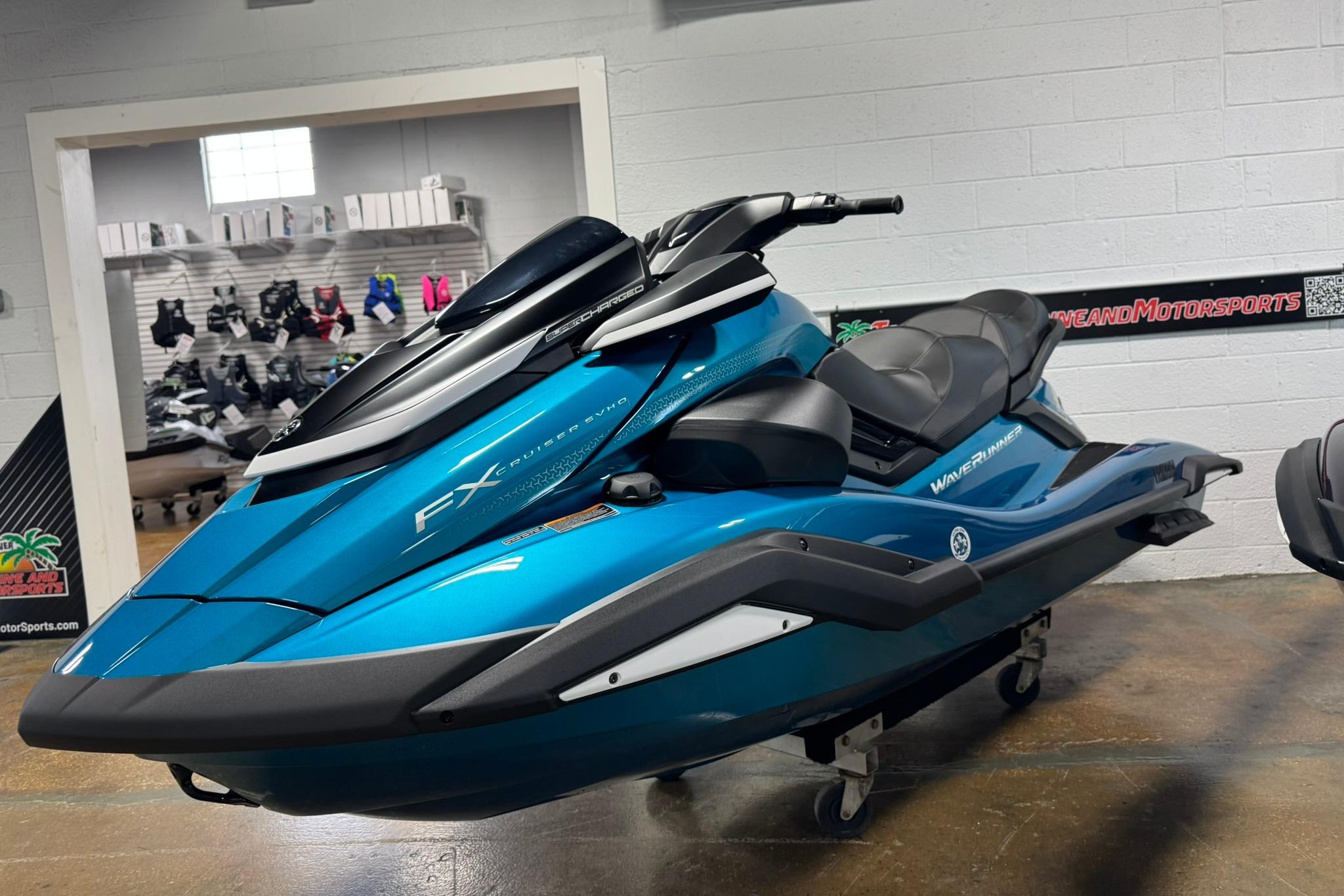 Yamaha WaveRunner FX Cruiser SVHO 2026 Yamaha WaveRunner FX Cruiser SVHO in showroom, sleek blue design.