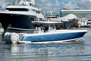 Intrepid 407 Nomad FE 2020 Intrepid 407 Nomad FE boat with Yamaha engines docked in marina.