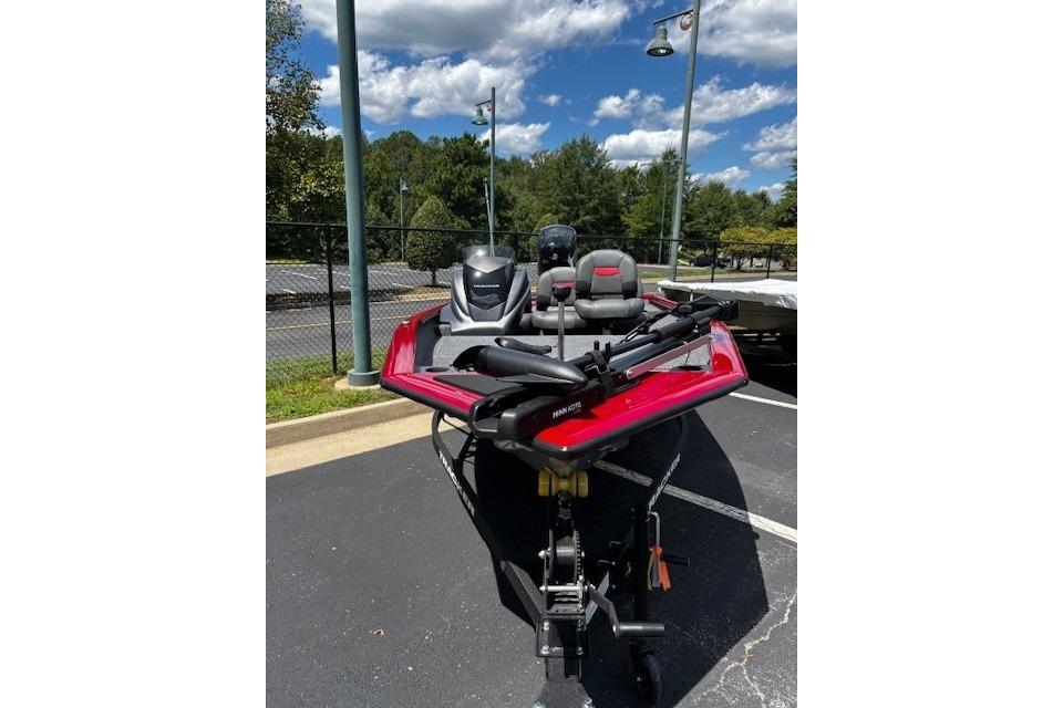 Tracker Pro Team 175 Crappie Edition 2026 Tracker Pro Team 175 Crappie Edition boat in parking lot under blue sky.