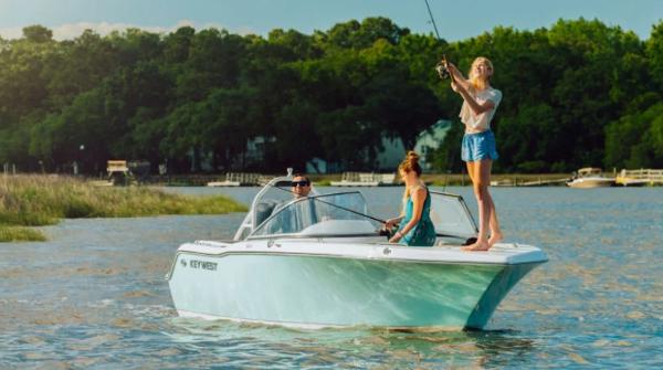 Key West 203 DFS 2025 Key West 203DFS boat on a lake with people fishing.