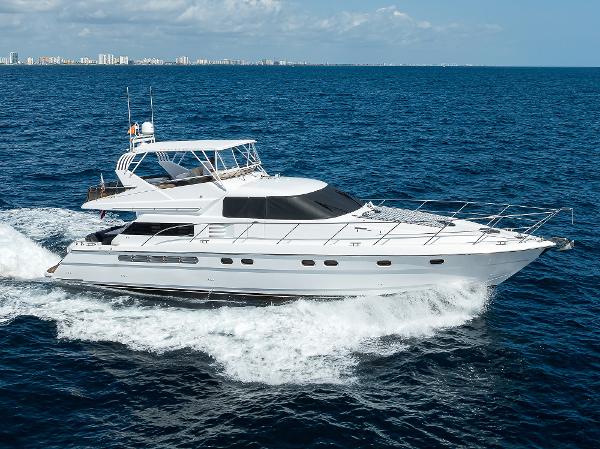 Fairline Squadron 65 1997 Fairline Squadron yacht cruising on the ocean.