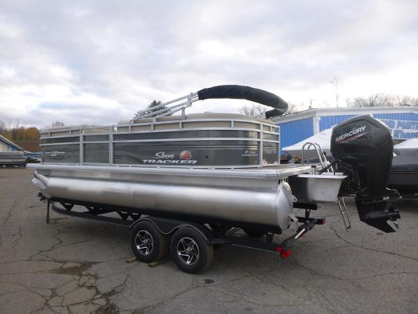 Sun Tracker Party Barge 20 DLX 2025 Sun Tracker Party Barge 20 DLX pontoon boat with Mercury outboard motor.