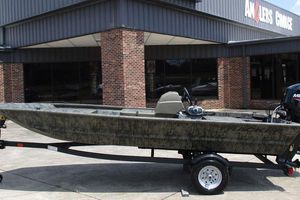 Tracker Grizzly 1648 SC 2026 Tracker GRIZZLY® 1648 SC boat on trailer outside Anglers Choice store.