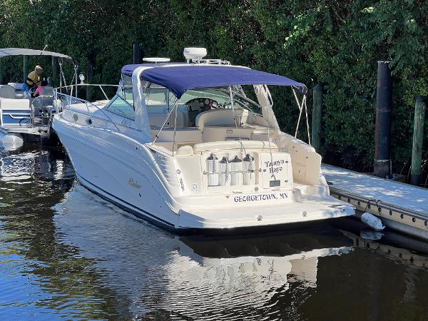 Rinker 342 Fiesta Vee 2003 Rinker 342 Fiesta Vee boat docked in a serene marina setting.