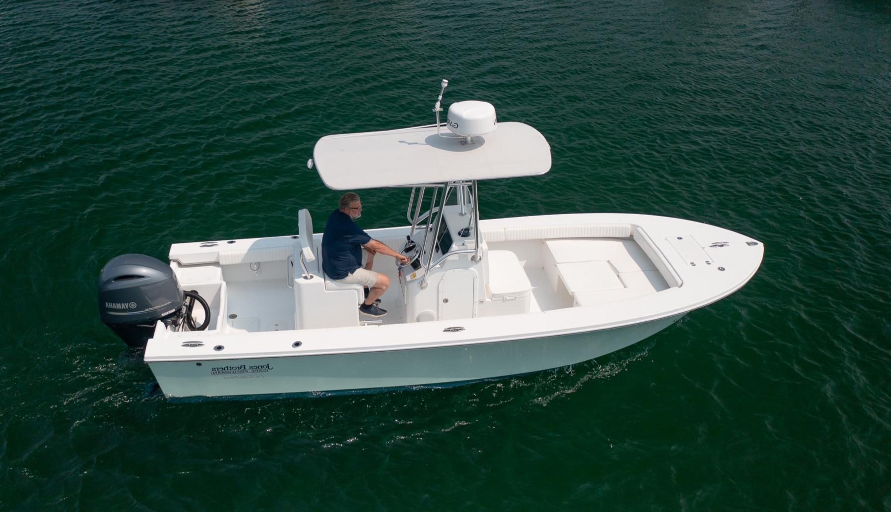 Jones Brothers 23 Cape Fisherman Lite Tackle 2024 Jones Brothers 23 Cape Fisherman Lite Tackle boat on water, side view.