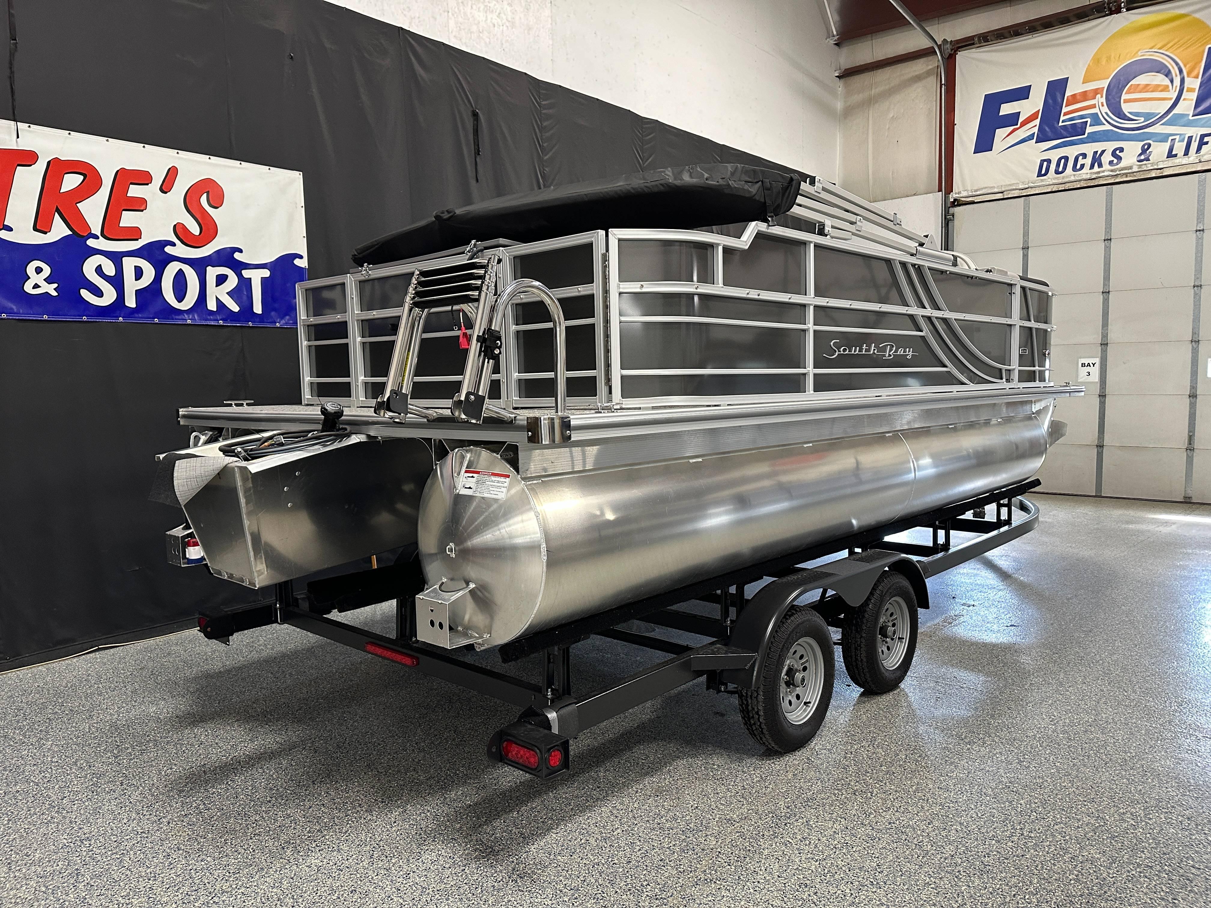 South Bay 222FCR LE 2.75 2025 South Bay 222FCR LE 2.75 pontoon boat on trailer in showroom.