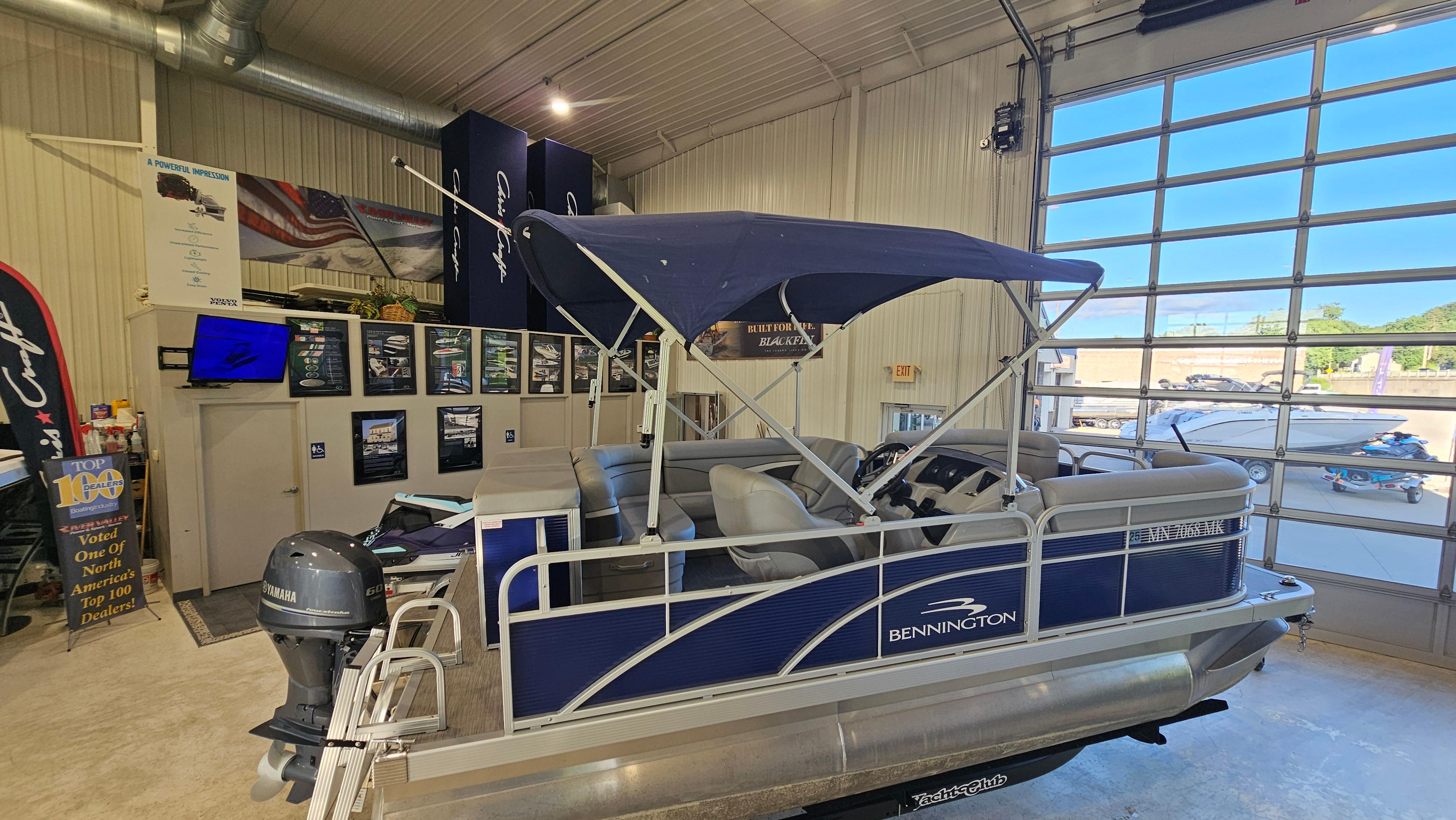 Bennington 188 SV 2020 Bennington 188 SV pontoon boat displayed indoors with Yamaha motor.