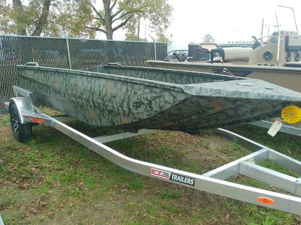 Edge Duck Boats 650 2025 Edge Duck Boats 650 on trailer, camo design, parked outdoors.