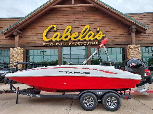 Tahoe 1950 Red 2025 Tahoe 1950 boat on trailer outside Cabela's store.