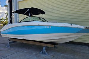 NauticStar 223 DC 2022 NauticStar 223 DC boat with blue and white hull, docked on a lift.