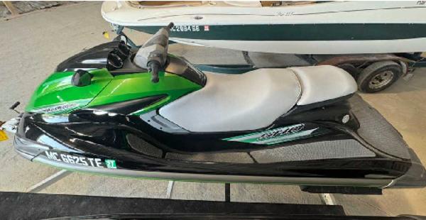 Yamaha WaveRunner FZS 2012 Yamaha WaveRunner FZS in green and black, parked indoors.