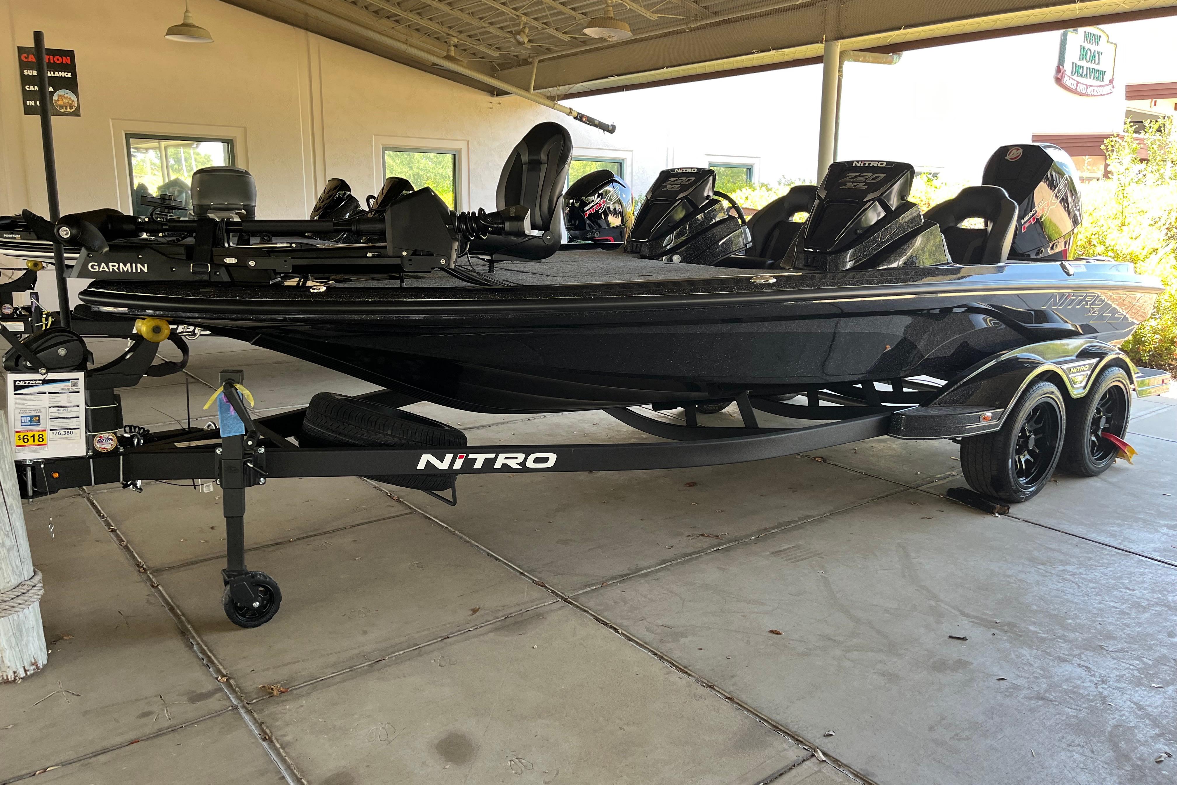 Nitro Z20 XL Pro 2026 Nitro Z20 XL Pro boat on trailer, featuring Garmin equipment, parked under a shelter.