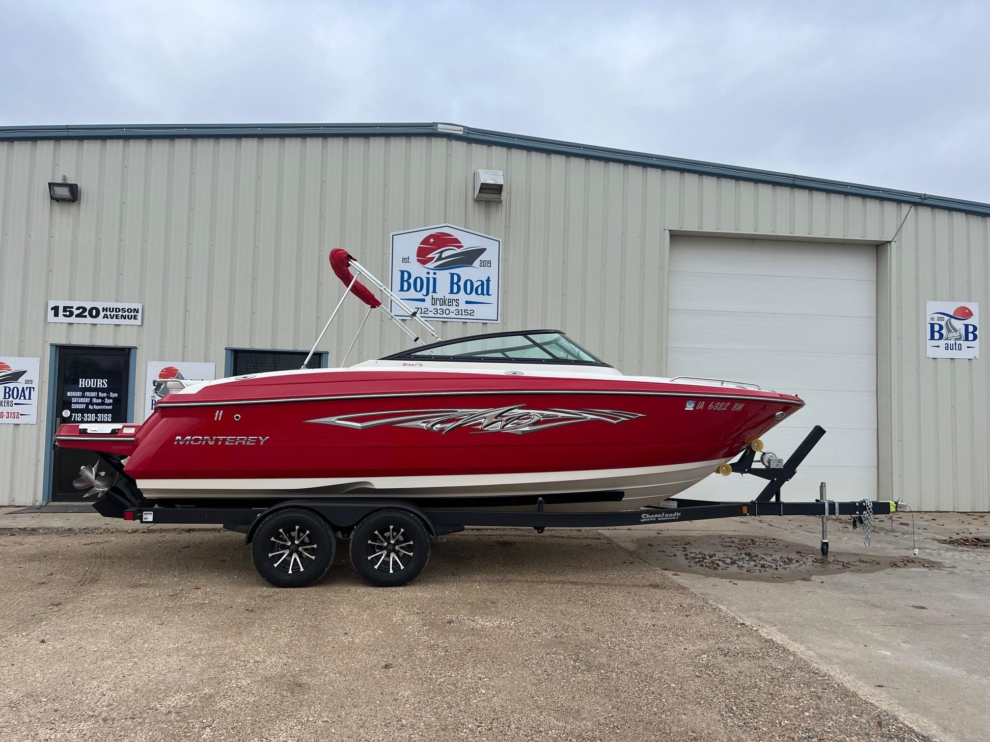 Monterey 244FS Red 2014 Monterey 244FS boat on trailer outside Boji Boat building.