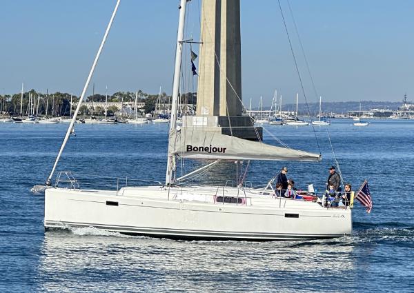 Hanse 385 Hanse 385 sailboat from 2012 cruising on a sunny day with people onboard.