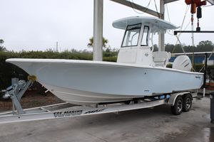 Tidewater 2500 Carolina Bay 2026 Tidewater 2500 Carolina Bay boat on trailer in marina setting.