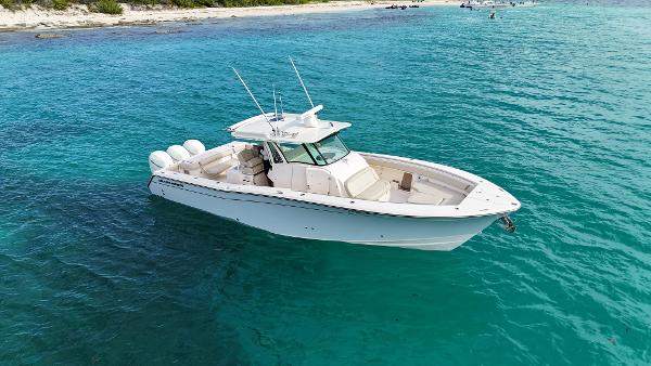 Grady-White Canyon 366 2013 Grady-White Canyon 366 boat on clear turquoise water near a beach.