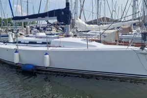 J Boats J/109 2003 J Boats J/109 sailboat docked in a marina, surrounded by other vessels.