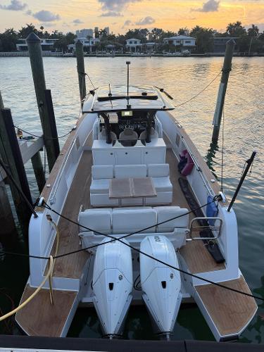Pardo Yachts 38 2022 Pardo Yachts 38 docked at sunset, featuring twin engines and spacious deck.