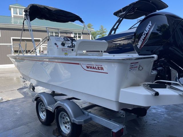 Boston Whaler 19 Montauk 2025 Boston Whaler 19 Montauk boat on trailer with Mercury engine.
