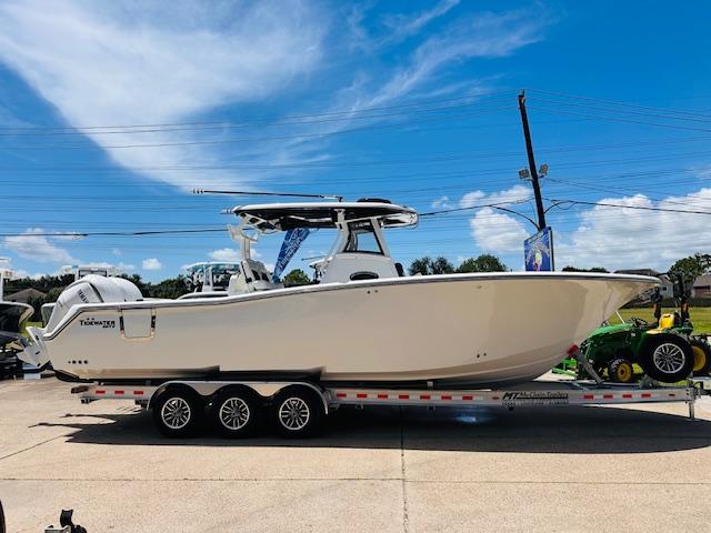 Tidewater 302 CC Adventure Tidewater 302 CC Adventure 2026 boat on trailer under clear blue sky.