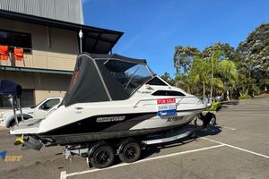 Whittley 2180 2019 Whittley 2180 boat for sale in parking lot, with contact number displayed.