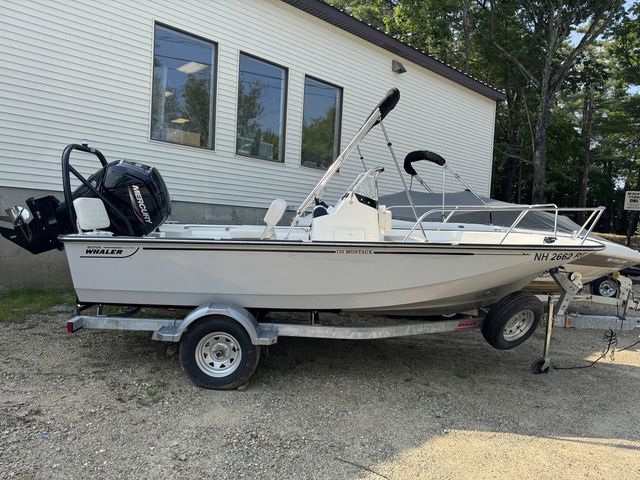Boston Whaler 170 Montauk 2025 Boston Whaler 170 Montauk boat on trailer, parked outdoors near a building.