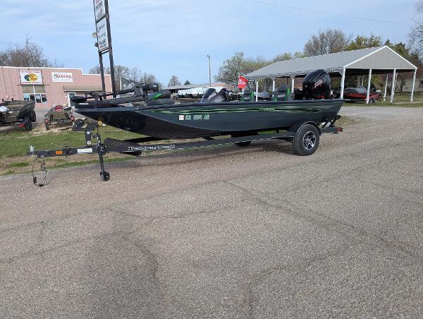 Ranger RT188P 2023 Ranger RT188P boat on trailer, parked outdoors near buildings.