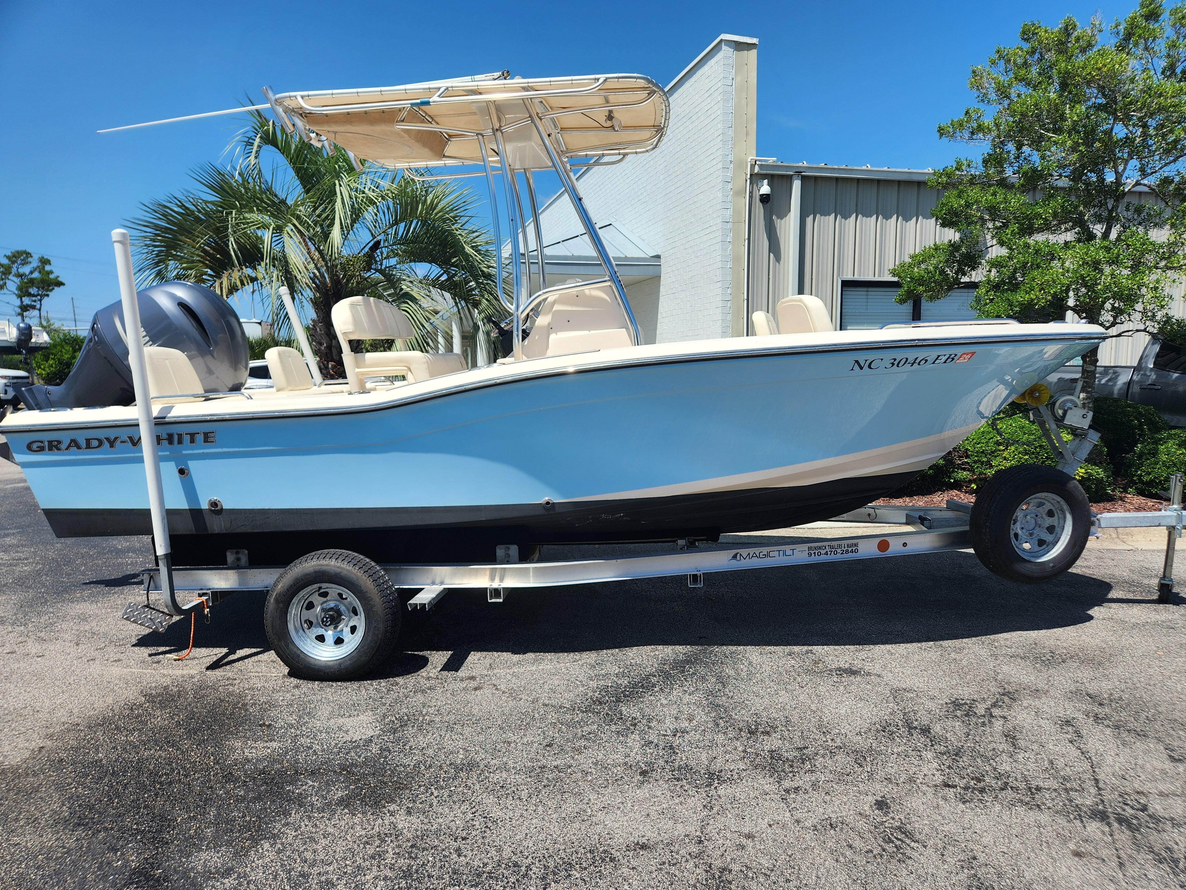 Grady-White 191 Coastal Explorer 2015 Grady-White 191 Coastal Explorer boat on trailer, parked outdoors.