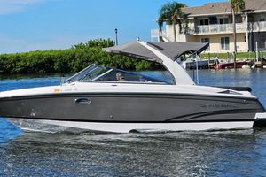 Regal 2700 ES Bowrider 2010 Regal 2700 ES Bowrider cruising on a sunny day near waterfront homes.
